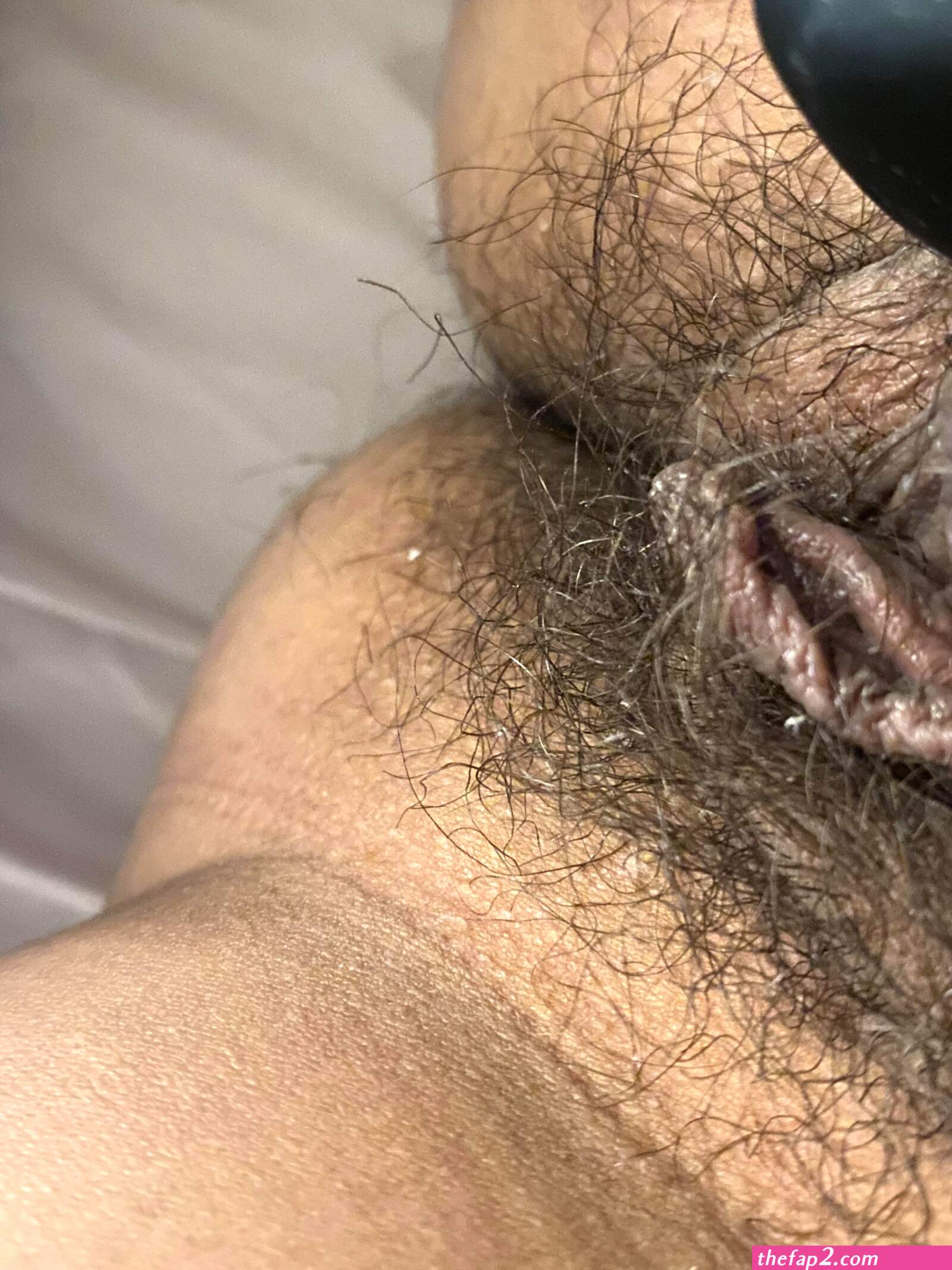 A jar inside a hairy pussy